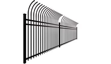 A black metal garden fence with a decorative curved top.