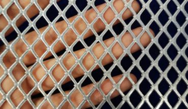 Building material expanded mesh for temporary fencing feature.