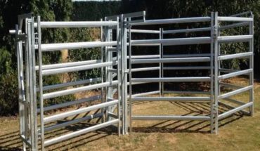 Cattle panel farm fence in silver color.