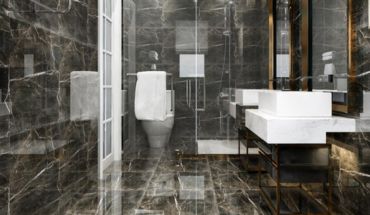 The bathroom floor is constructed out of polished tiles.