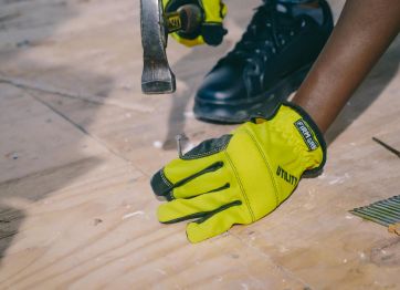 Carpenter uses framing nails in construction.