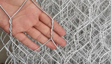 Gabion box hexagonal iron wire mesh woven net on hand.