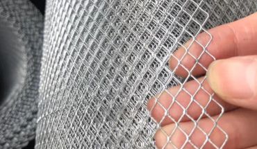 Galvanized iron metal mesh sheet sample.