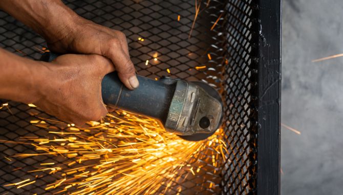 Galvanized wire mesh fence in black color soldering for installation.