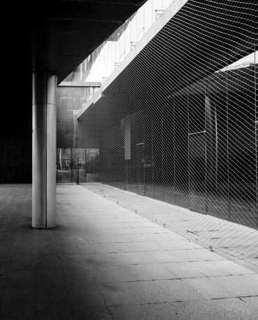 Galvanized wire mesh panel fence in industrial application.