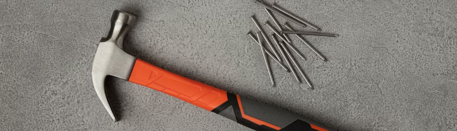 Headless nails and hammer in the floor.