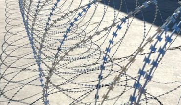 Helical concertina wire spread in the yard.