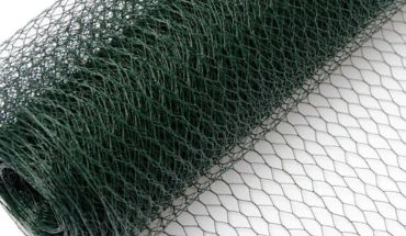 Hexagonal galvanized wire woven mesh roll and netting in dark green color.