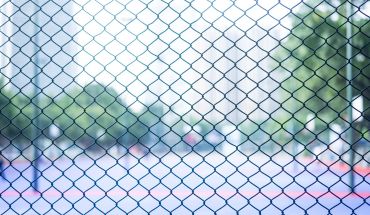 Metal mesh used to surround a field.