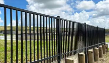 Metal iron tubular garden fence in straight design.