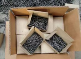 Open small boxes of nails packed in one box.