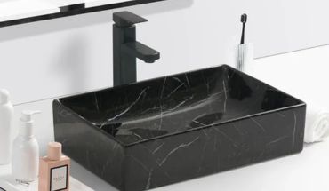 Rectangular wash basin countertop in black color.