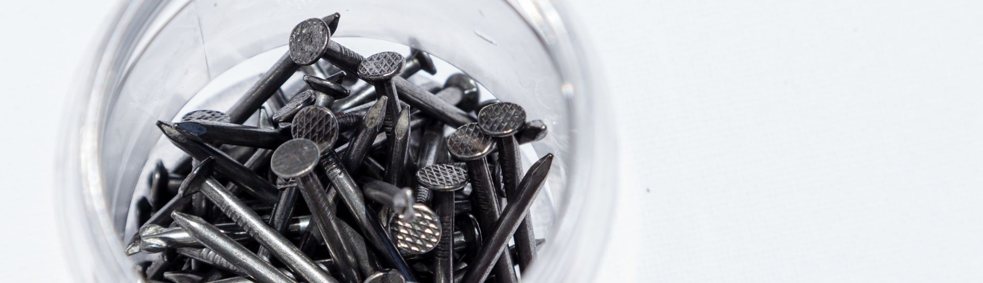 Roofing nails in a jar.