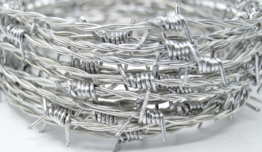 Security barbed wire fence in silver color.