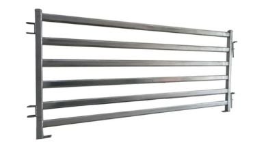 Wide steel metal farm fence.
