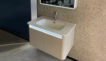 Wall mounted wash basin with cabinet.