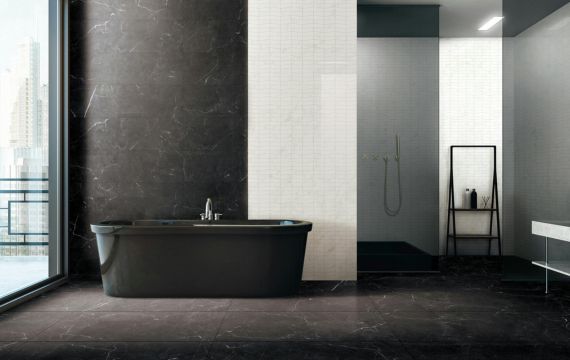 Black stylish modern bathtub in contemporary style bathroom.