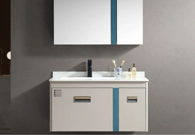 Laminated cabinet for bathroom in white color.