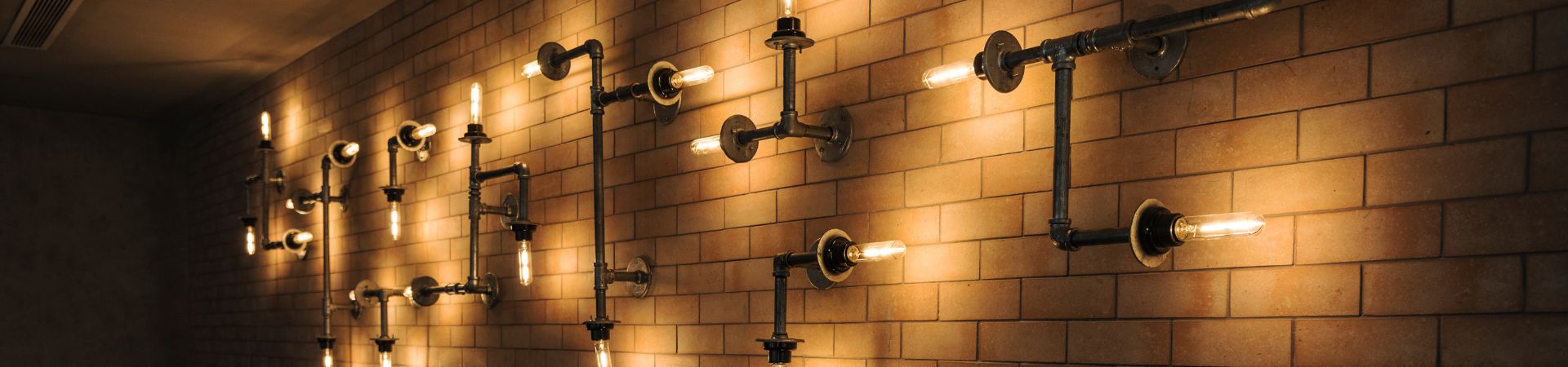 Light and bulb in stylish wall decor.