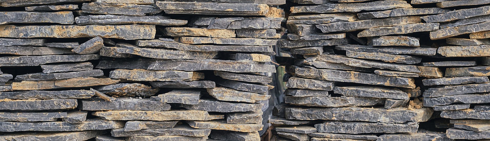 Natural stone slabs in earthy tone.