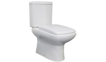 Porcelain two piece toilet in white color.