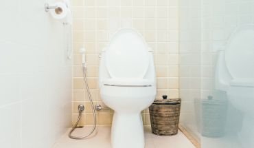 Restaurant toilet in white ceramic color.
