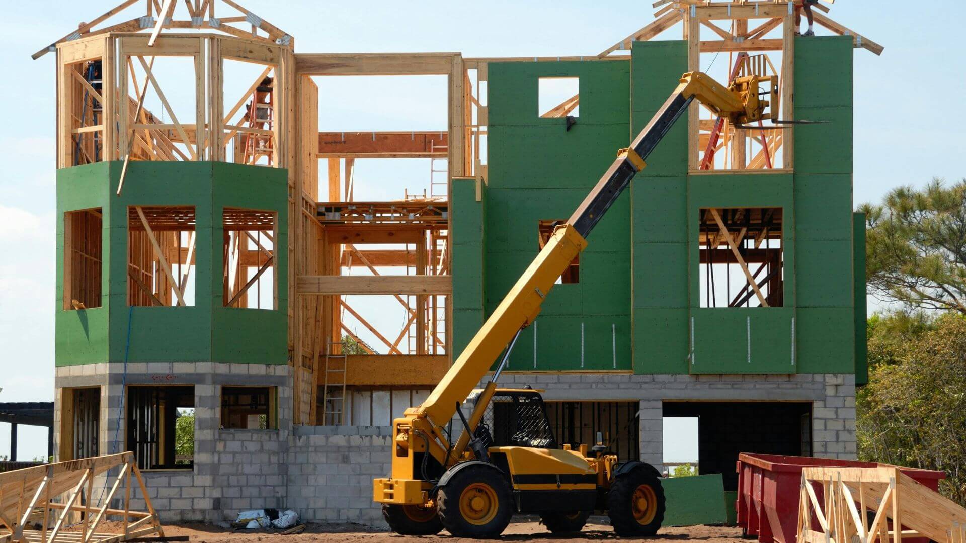 Rising construction work with building materials.
