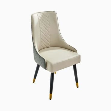 Upholstered beige gray dining chair with gold accent.