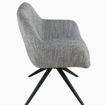 Upholstered dining chairs with arms swivel.