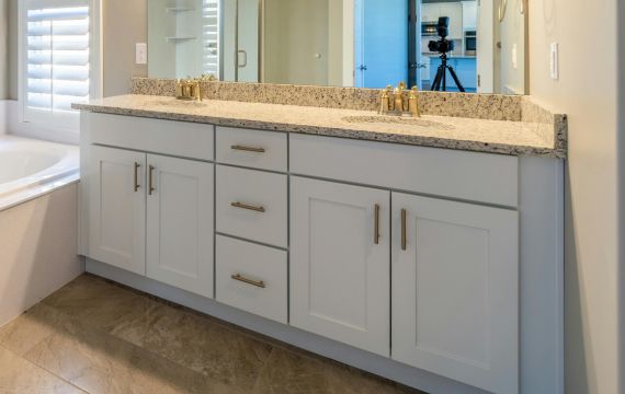 White color wood cabinet with handle.
