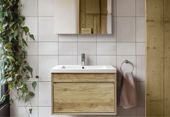 Wood cabinet with sink.