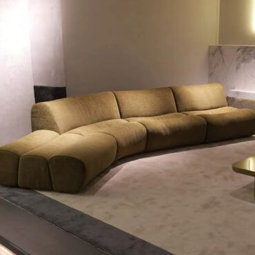 U shape velvet custom made sofa in shade of brown.